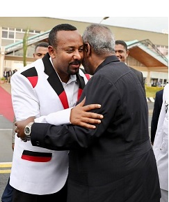 Abiy Ahmed greets Omar al-Bashir at the ceremony